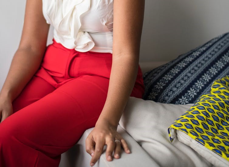 Image of a woman sitting on a couch