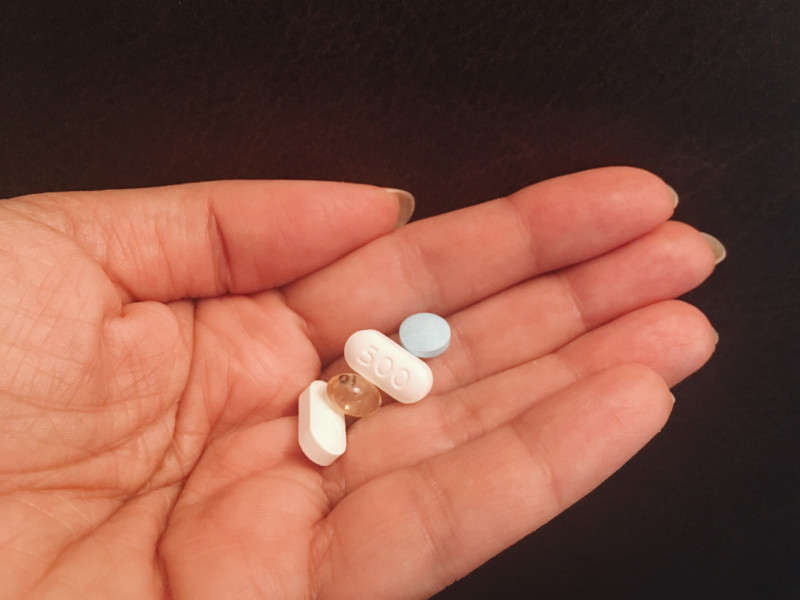 Image of a hand holding pills