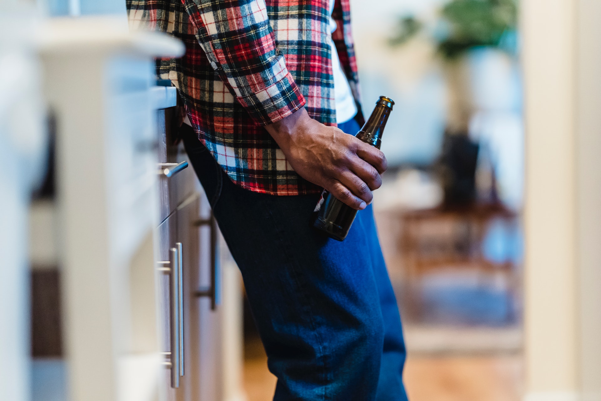 Man holding beer bottle