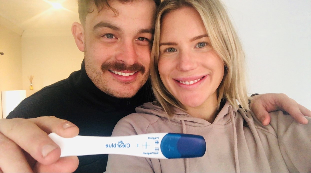 Image of a couple with pregnancy test