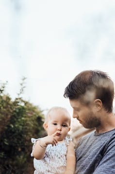 Image of a father and baby
