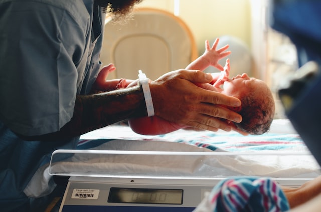 Newborn being weighed in hospital