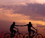 Image of couple on bicycles